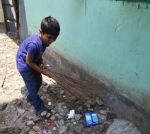 Abdullah cleaning the neighborhood