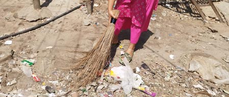 Boishakhi cleaning the neighborhood