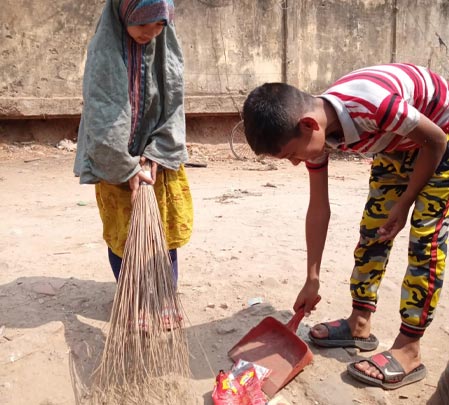 Jannat and Morsalin cleaning the neighborhood