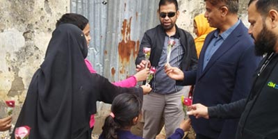 Kids giving flowers to the guests