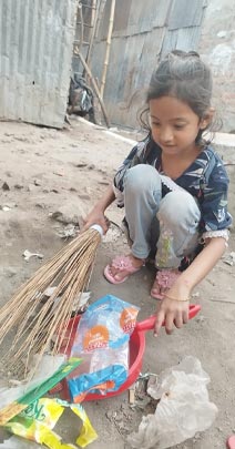 Sumona cleaning the neighborhood